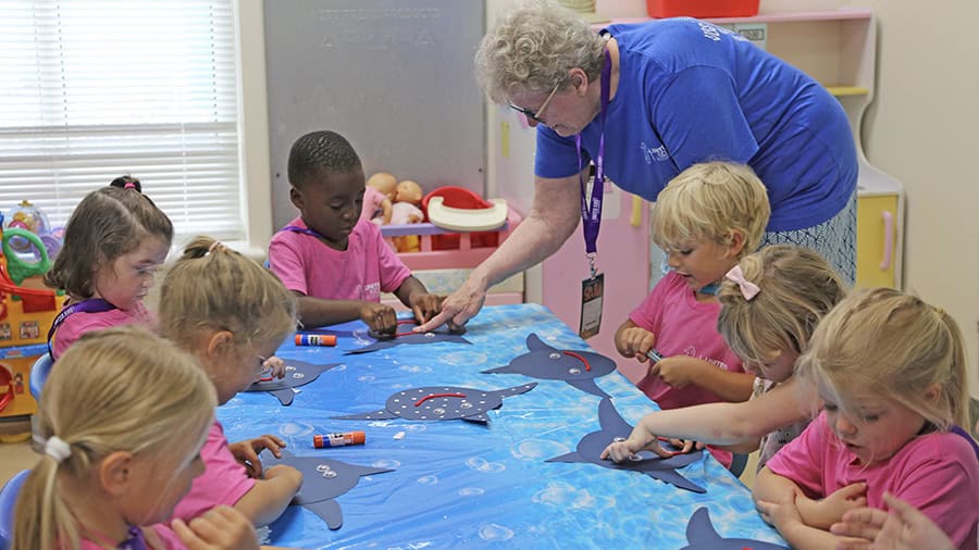 VBS Adult Volunteer Helping With Art